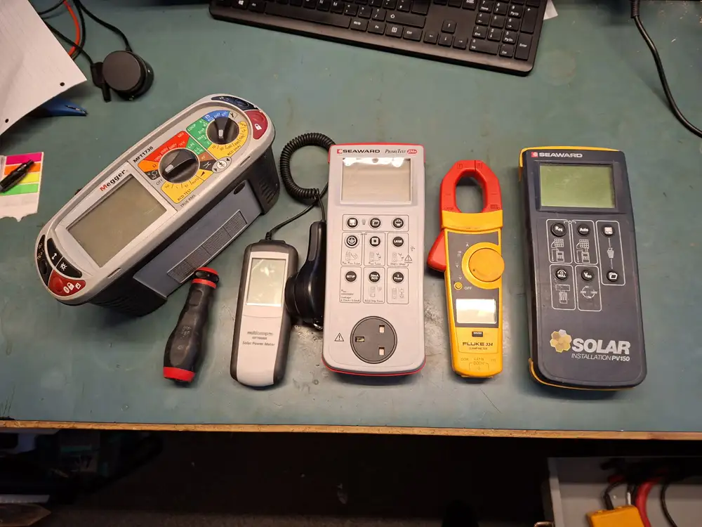 Test equipment ready for calibration, including a multifunction tester, PAT tester, clamp meter and solar PV tester